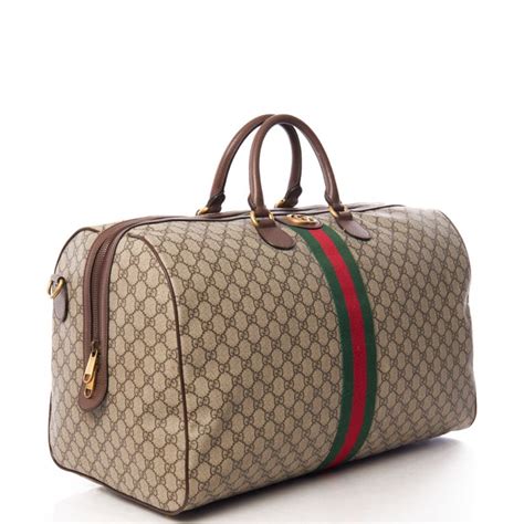 gucci supreme holdall